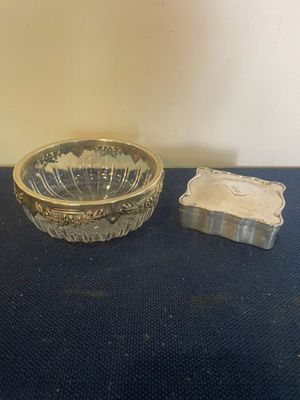 a glass bowl and a soap dish on a table