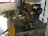 a picture of a machine that is working on a piece of paper
