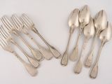 six forks and six spoons sitting next to each other on a white surface