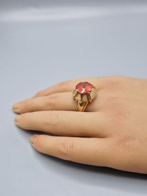 an image of a woman ' s hand with a ring on it ' s finger