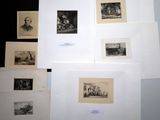 a lot of pictures on the wall of a room
