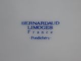 a close up of a plate with the words bernard limoges on it