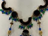 a close up of a necklace on a mannequin mannequin