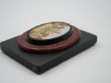 a picture of a small wooden plaque with a picture on it