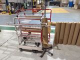 a cart with rolls of brown paper on it in a warehouse