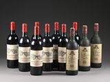 six bottles of red wine are lined up in a row