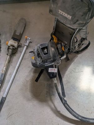 a backpack and tools on the floor in a room