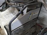 a machine that is sitting inside of a garage