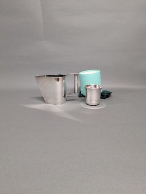 CHRISTIAN DIOR Pot à crème en métal argenté On y joint :