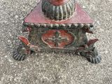 a statue of a bird sitting on top of a box