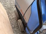 a small blue machine that is sitting on the ground