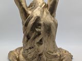 sculpture of a horse ' s head on a piece of wood
