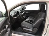 the interior of a car with the door open and the driver ' s seat up