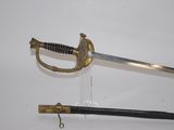 an old sword with a wooden handle and a black handle
