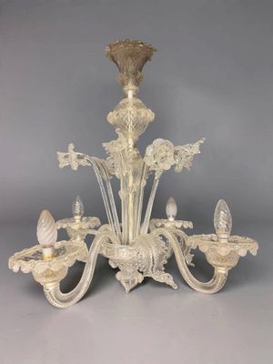 an image of a chandelier made of glass with a bird on it