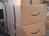 boxes stacked on top of each other on a pallet in a warehouse