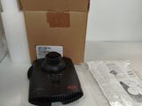 a box with a remote control sitting on top of a counter