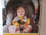 a box with a picture of a baby in a car seat