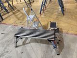 a metal bench that is sitting in the middle of a room