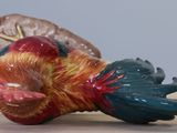 a figurine of a bird on a table