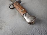 a small knife that is laying on a table