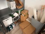 a carton filled with boxes and other items in a room