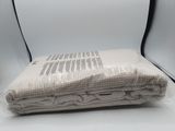 a blanket that is sitting on top of a chair