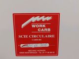 a red sign that says work and care on the side of a refrigerator