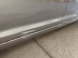 a car that has a dent in the side of it