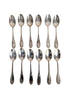six silver spoons and two silver spoons on a white background