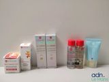 many different types of skin care products displayed on a table