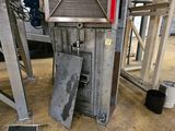 an image of a machine that is working on a piece of metal