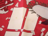 a close up of a red and white shirt with a christmas tree on it