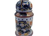 an image of a blue and white jar with grapes on it