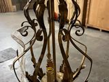 a chandelier that has a candle inside of it