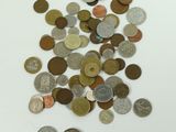 a pile of coins on the table with a white background