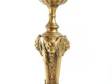 an image of a gold colored candle holder on a white background
