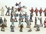 a lot of figurines that are on a white surface