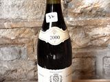 a bottle of wine that is sitting on a table