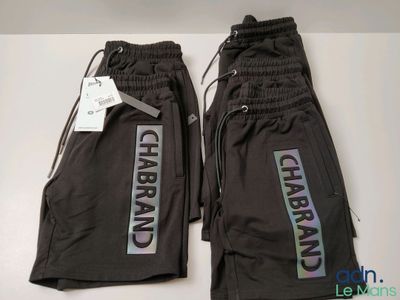 two pairs of black pants with the words charbran on them