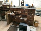 many drawers and drawers that are open in this room