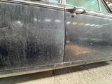 a car that has been scratched and is parked in a garage