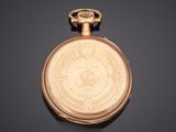 an antique gold pocket watch with a medallion on the face