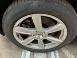 a close up of a tire on a car ' s rim