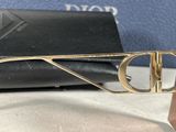 christian dior sunglasses with gold metal frame and logo