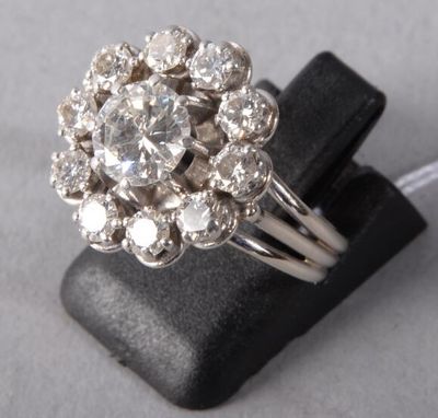 an image of a diamond ring on a black ring holder