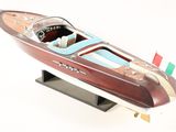 a model of a boat on display on a white surface