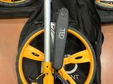 two yellow wheels on the back of a black bag