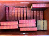 a lot of books that are sitting on a shelf