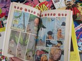 a person holding a comic book in their hand